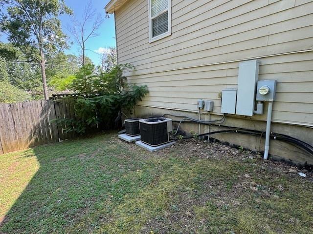 view of yard featuring central air condition unit