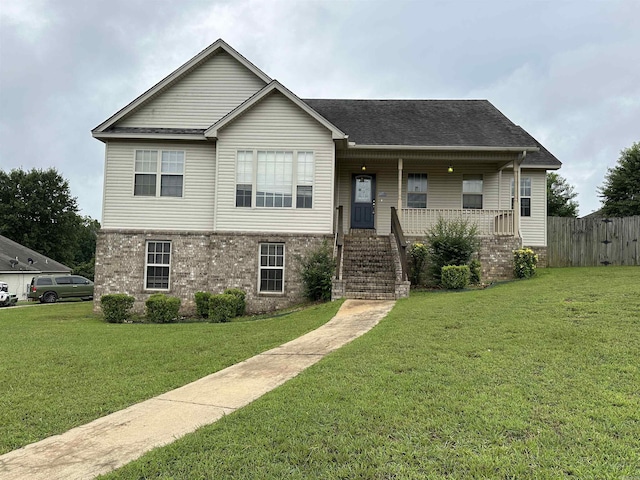 view of front facade featuring a front lawn and a porch