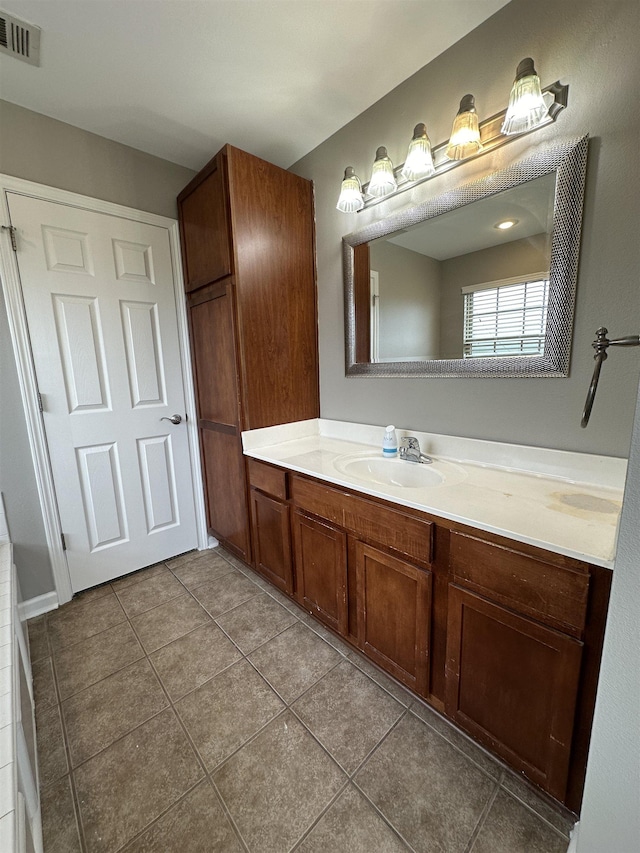 bathroom with vanity and tile patterned flooring