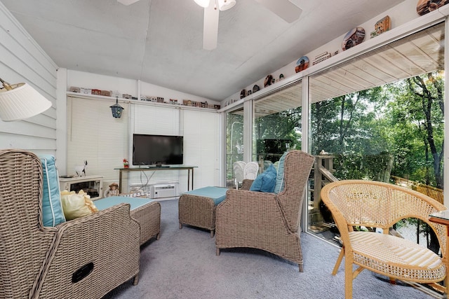 sunroom / solarium featuring ceiling fan and vaulted ceiling