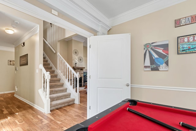 game room with wood-type flooring, pool table, and ornamental molding