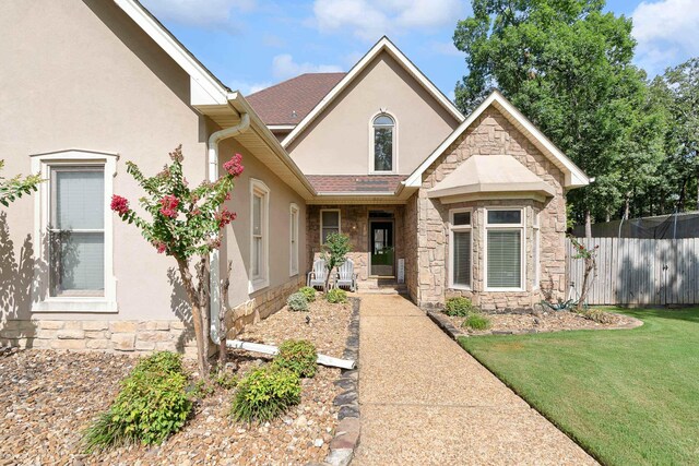 view of front of home with a front lawn