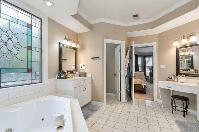 bathroom featuring a tub to relax in, tile patterned floors, crown molding, and vanity