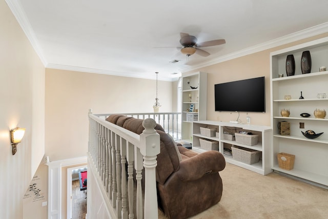 carpeted living room with ceiling fan and ornamental molding