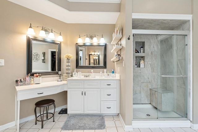 bathroom featuring vanity, a shower with door, and tile patterned flooring