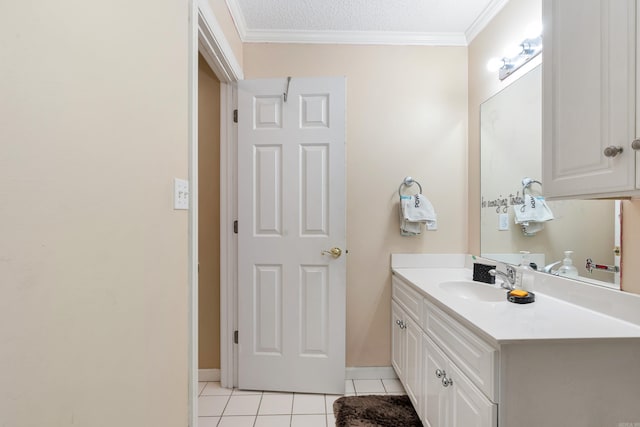 bathroom featuring vanity, crown molding, a textured ceiling, and tile patterned flooring