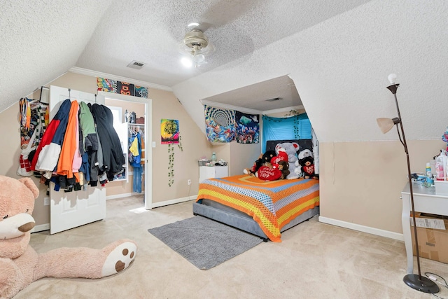 bedroom featuring light colored carpet, a textured ceiling, a closet, and vaulted ceiling