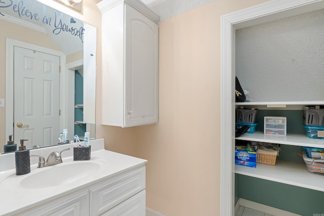 bathroom featuring tile patterned floors and vanity