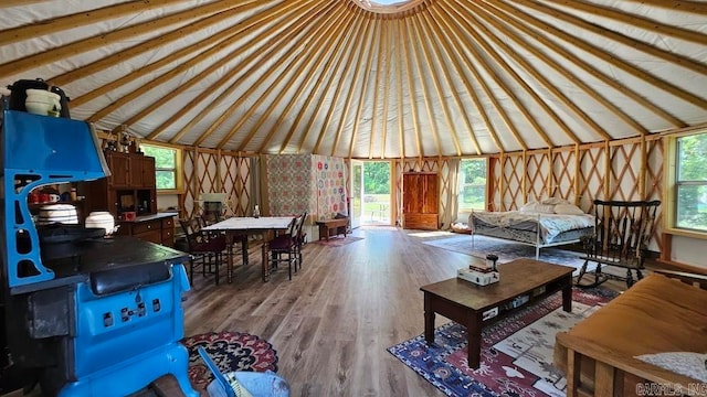 living room featuring vaulted ceiling and hardwood / wood-style floors