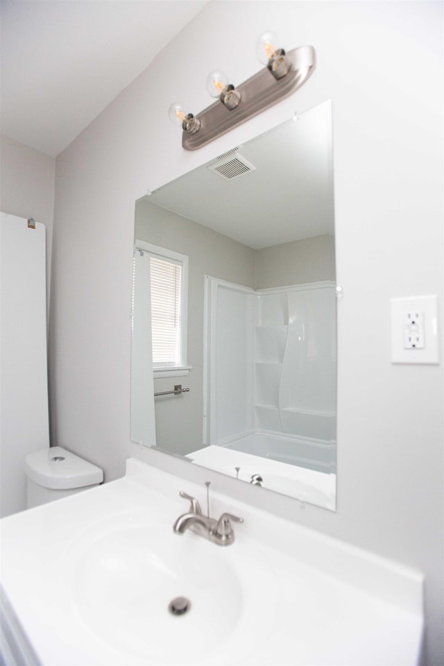 full bathroom featuring toilet, tub / shower combination, and vanity