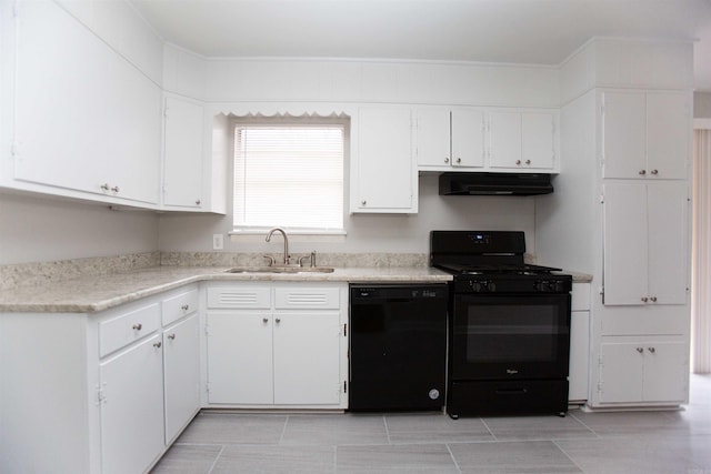 kitchen featuring white cabinetry, sink, and black appliances