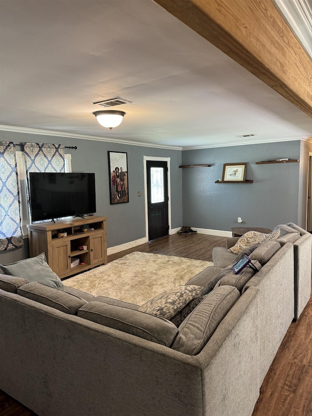 living room with crown molding and dark hardwood / wood-style flooring