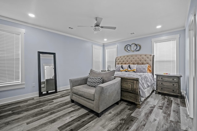 bedroom with ceiling fan, crown molding, and dark hardwood / wood-style floors