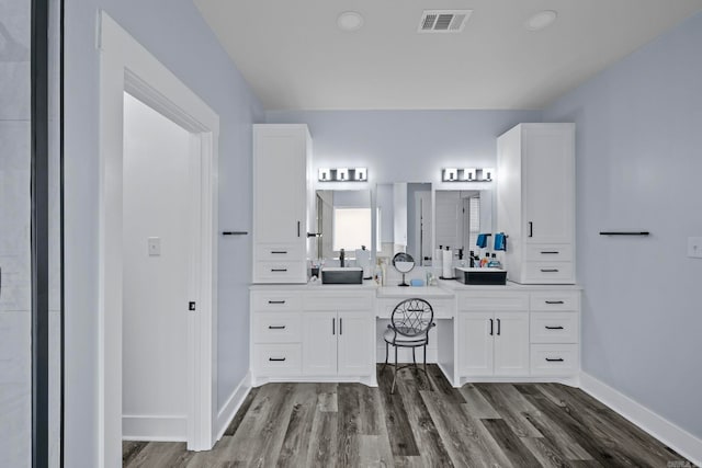 bathroom featuring hardwood / wood-style floors and vanity