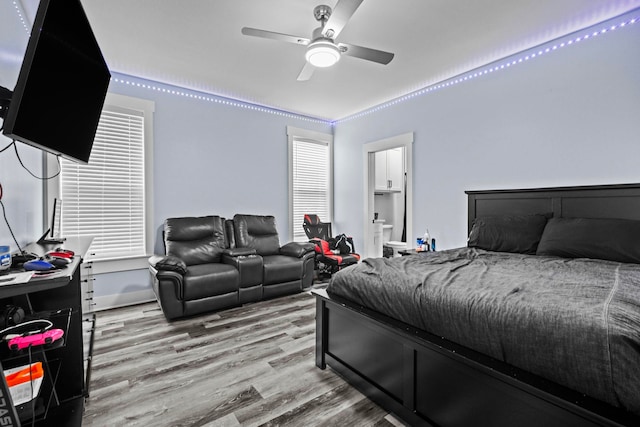 bedroom featuring ceiling fan and light hardwood / wood-style flooring