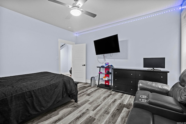 bedroom with ceiling fan and light wood-type flooring