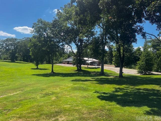 view of property's community featuring a yard