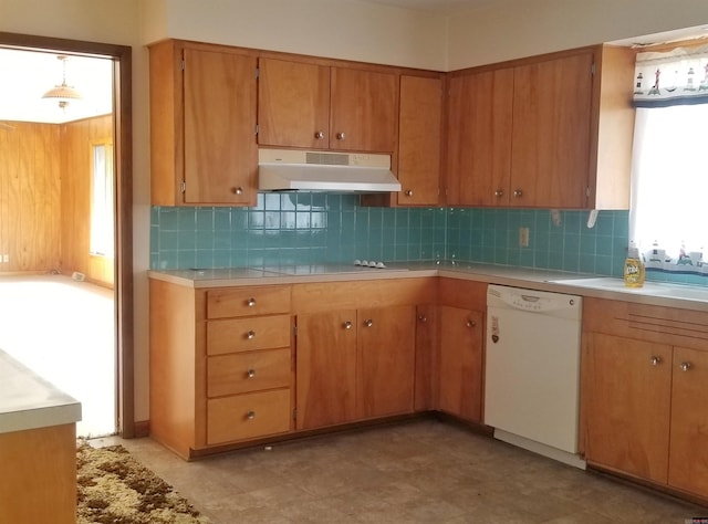 kitchen featuring black electric stovetop, decorative backsplash, plenty of natural light, white dishwasher, and light tile patterned floors