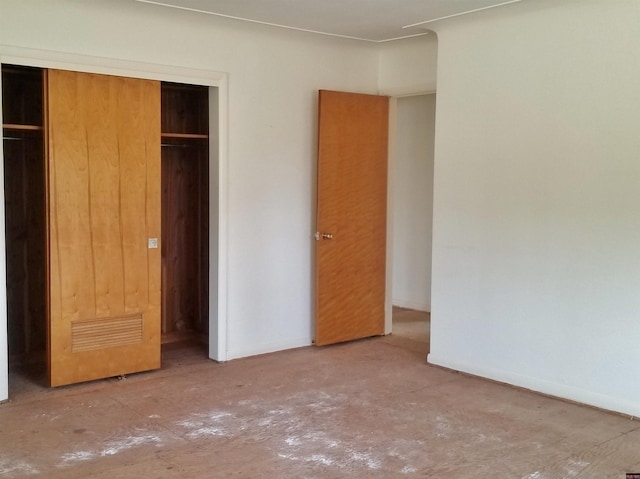 unfurnished bedroom with a closet