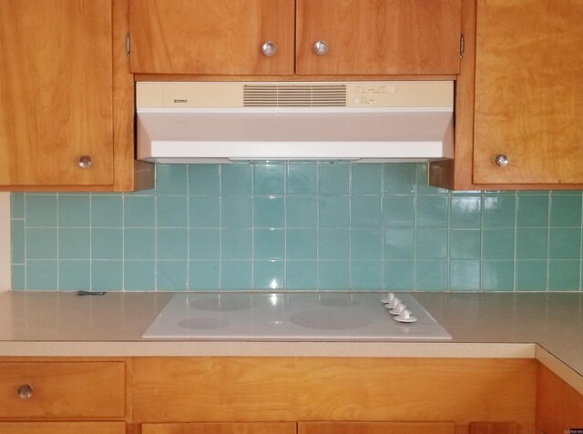 kitchen with electric cooktop and backsplash