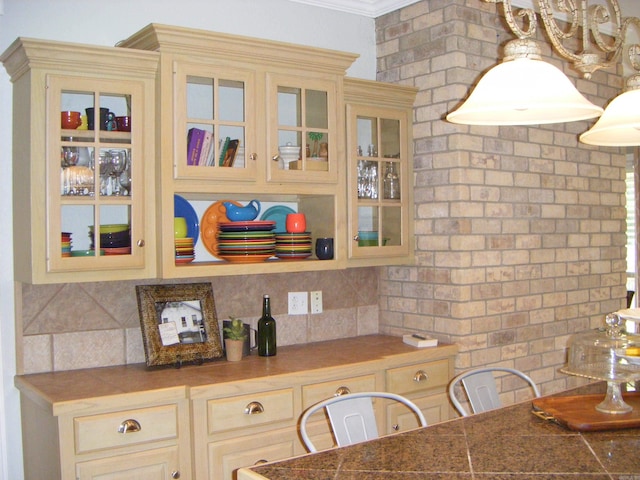 kitchen with tasteful backsplash and crown molding