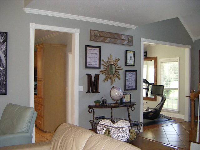 tiled living room featuring lofted ceiling and crown molding