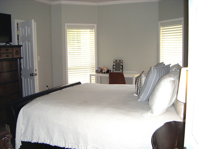 bedroom with crown molding