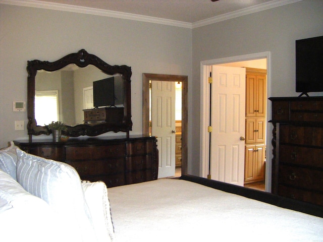 bedroom with ornamental molding