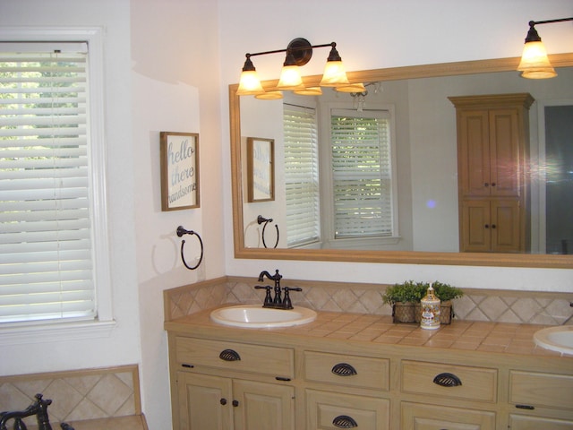 bathroom featuring plenty of natural light and vanity