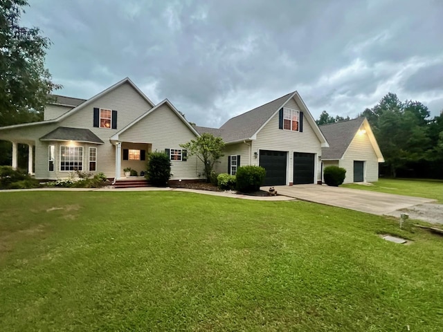 view of front of property with a front yard and a garage