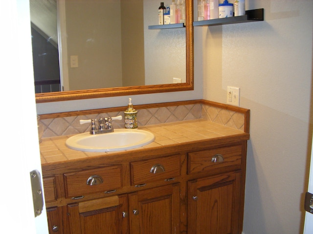 bathroom with backsplash and vanity