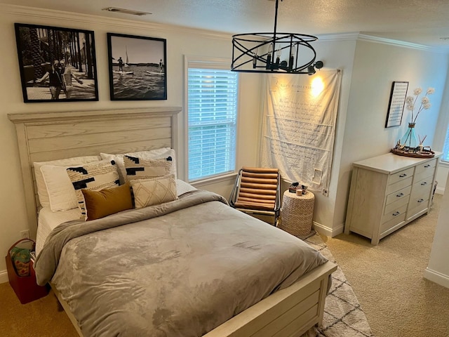 carpeted bedroom with a notable chandelier, crown molding, and a textured ceiling