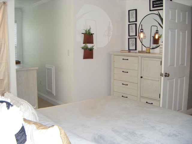 bedroom with crown molding