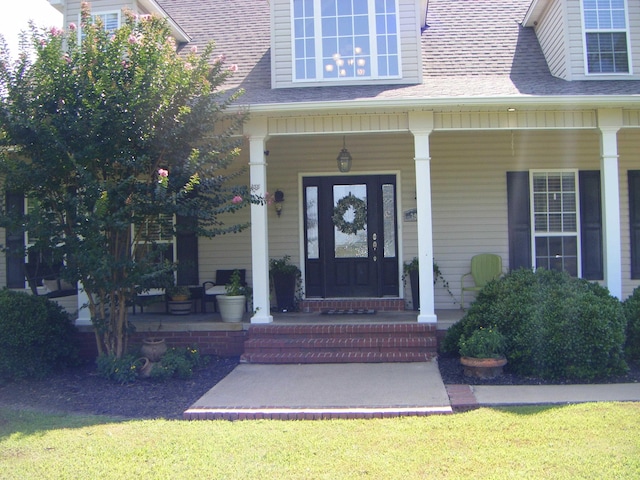 doorway to property featuring a porch