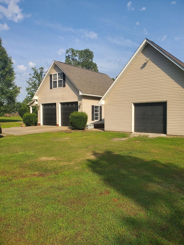 view of front of house with a garage and a front yard