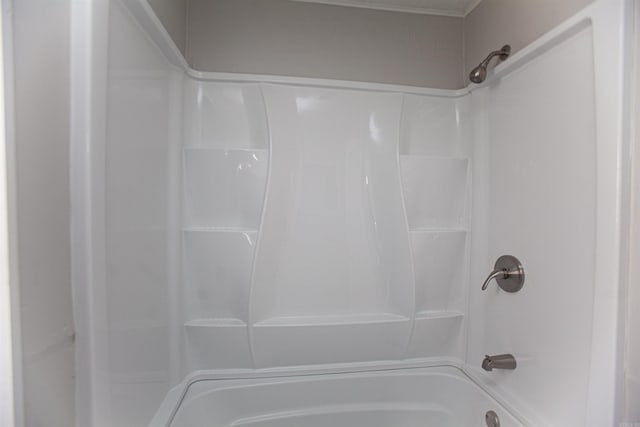 bathroom with bathing tub / shower combination