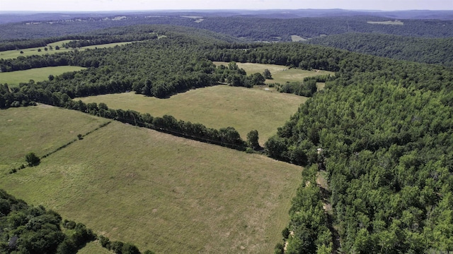 birds eye view of property with a rural view