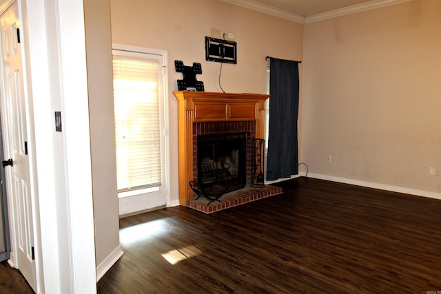 unfurnished living room featuring a fireplace, ornamental molding, and dark hardwood / wood-style floors