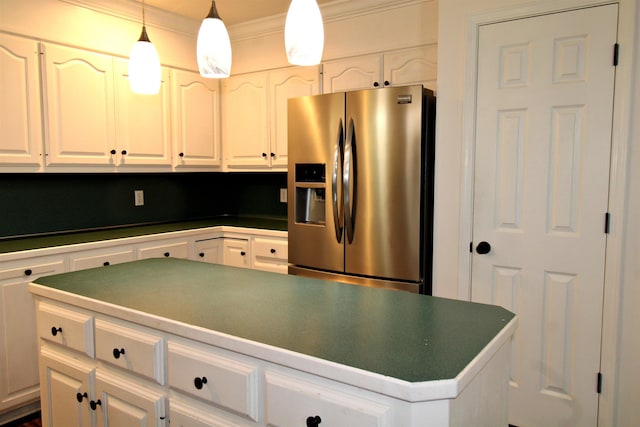 kitchen featuring white cabinetry, a center island, stainless steel fridge with ice dispenser, and pendant lighting