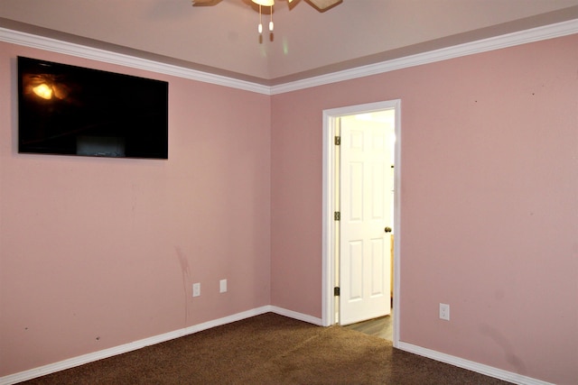 carpeted empty room featuring ornamental molding and ceiling fan