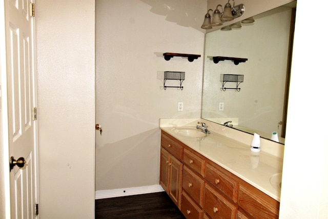 bathroom featuring hardwood / wood-style flooring and vanity