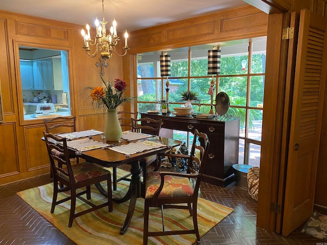 400 Neill Rd, Helena, AR 72342 - dining area featuring an inviting chandelier, dark parquet flooring, and a wealth of natural light