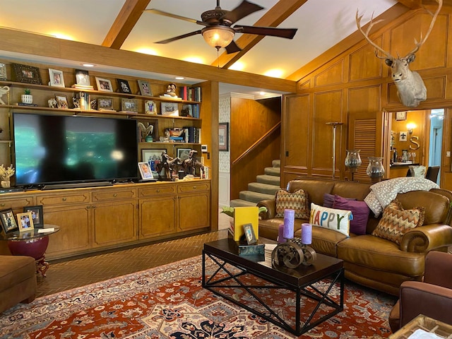 400 Neill Rd, Helena, AR 72342 - living room featuring built in features, wood walls, vaulted ceiling with beams, and ceiling fan