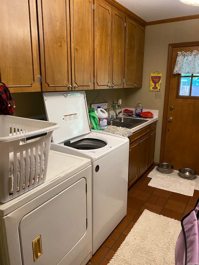 400 Neill Rd, Helena, AR 72342 - laundry area featuring tile patterned flooring, ornamental molding, sink, cabinets, and independent washer and dryer