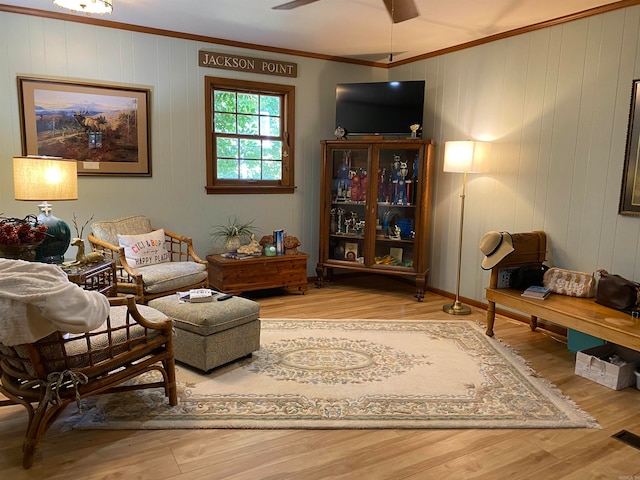 400 Neill Rd, Helena, AR 72342 - living room with light hardwood / wood-style flooring, ceiling fan, and crown molding