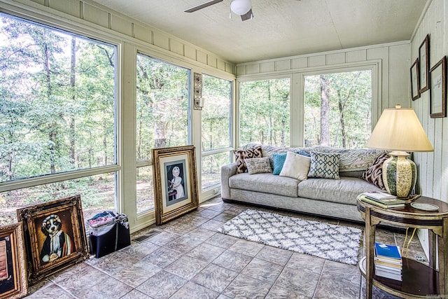 sunroom / solarium with ceiling fan