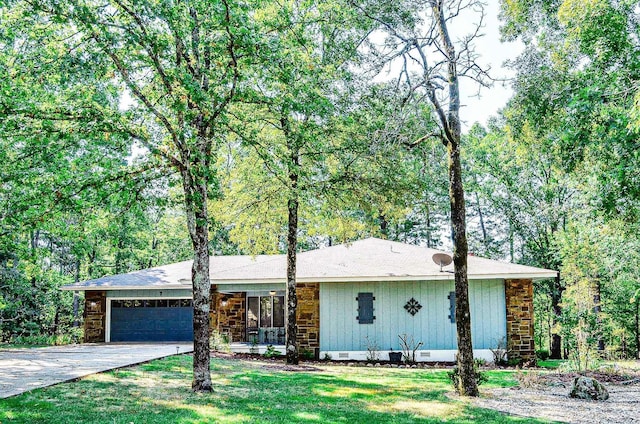 ranch-style home featuring a garage and a front yard