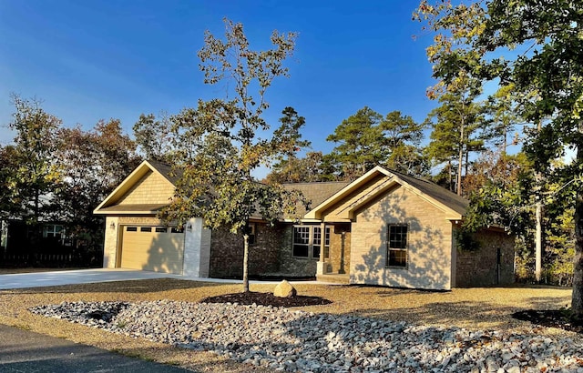 view of front of property featuring a garage and concrete driveway