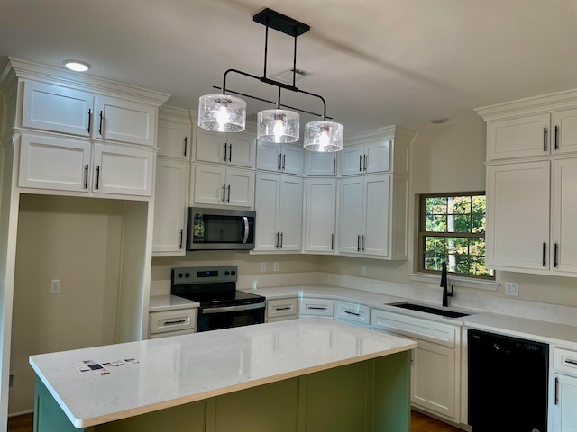 kitchen featuring hanging light fixtures, white cabinetry, a sink, a kitchen island, and black appliances