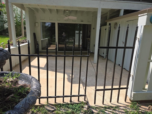 view of gate with a ceiling fan